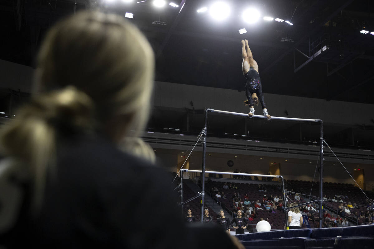 Trista Goodman, Southern Utah University, competes in uneven bars during session one of the Sup ...
