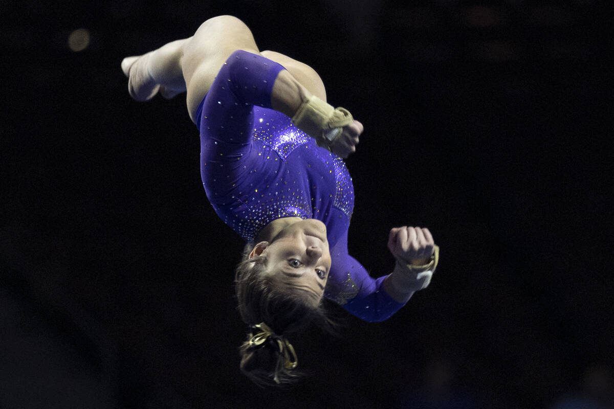 Emily Innes, University of Washington, competes in the floor exercise during session one of the ...