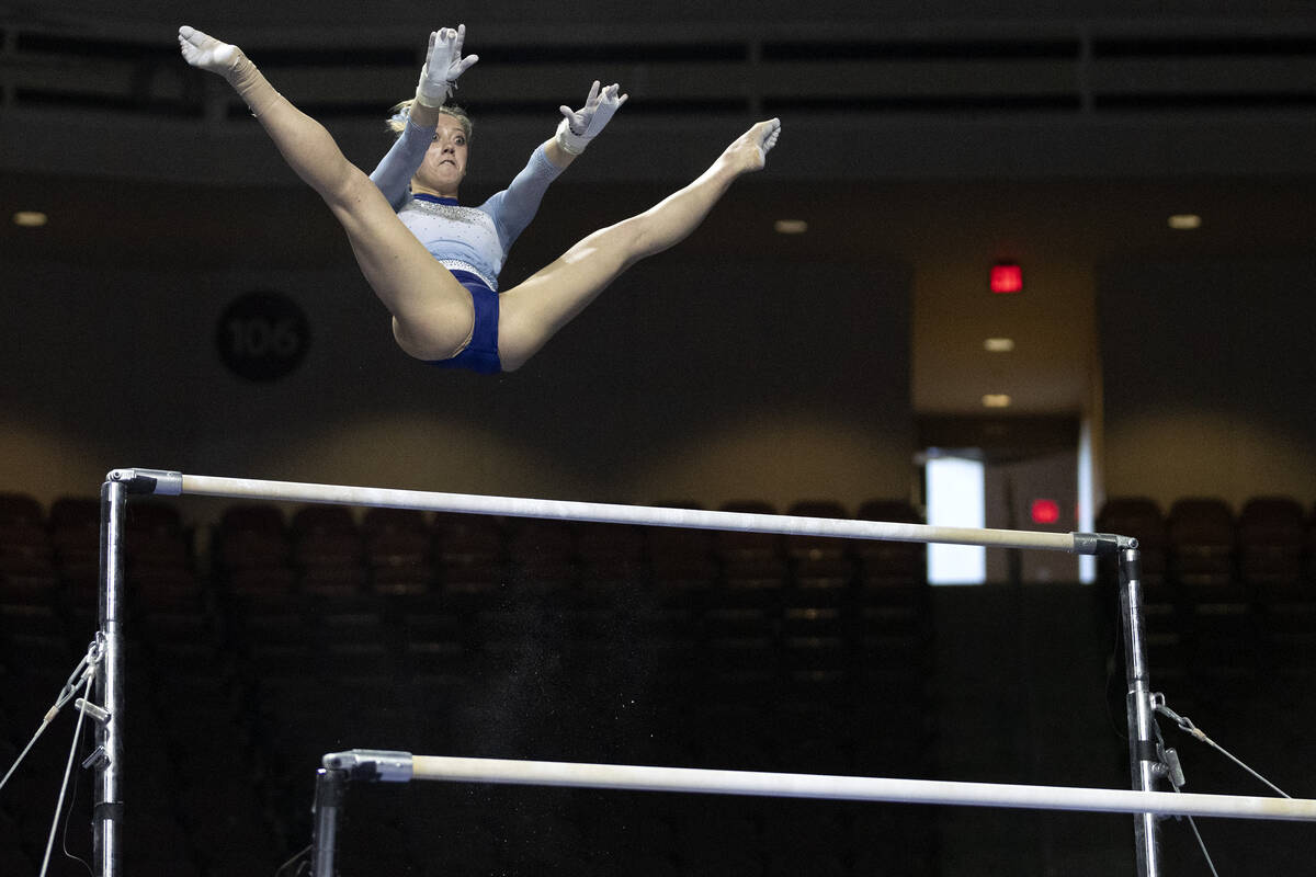 Isabelle Schaefer, the University of North Carolina, competes in uneven bars during session one ...