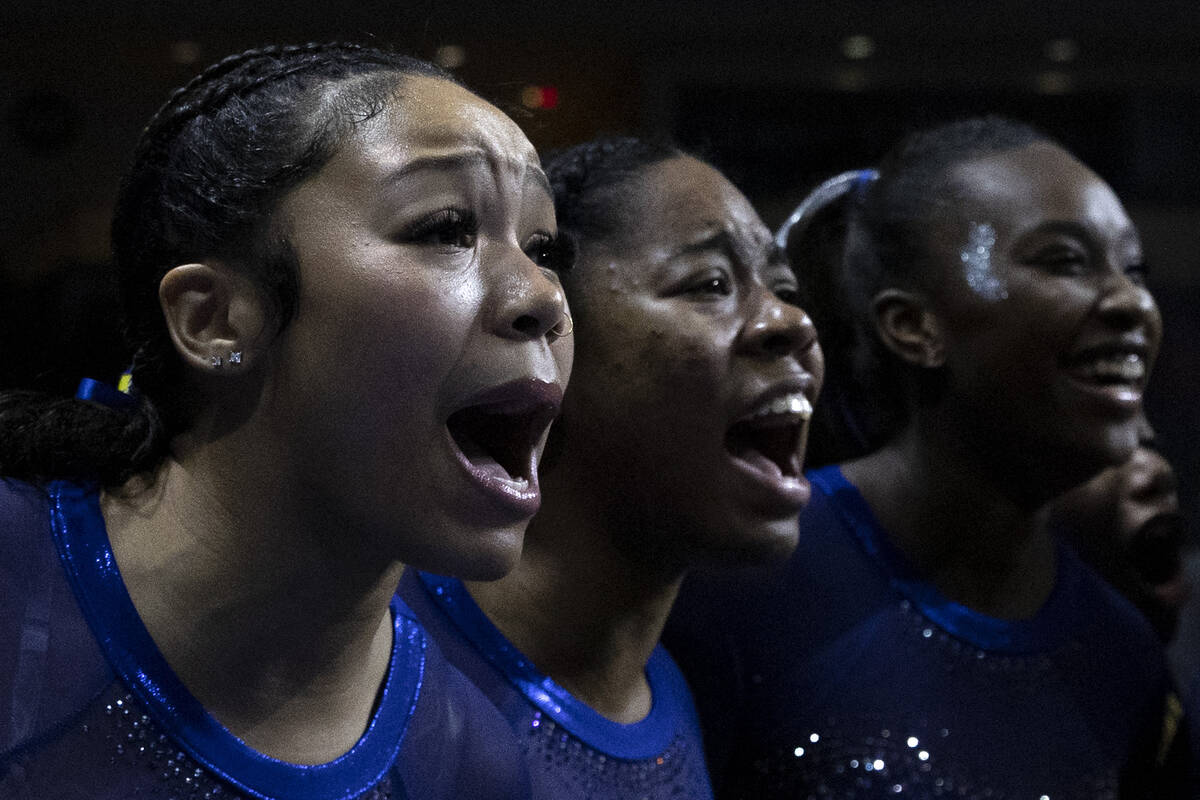 Members of Fisk University’s team cheer while their team competes in floor during sessio ...