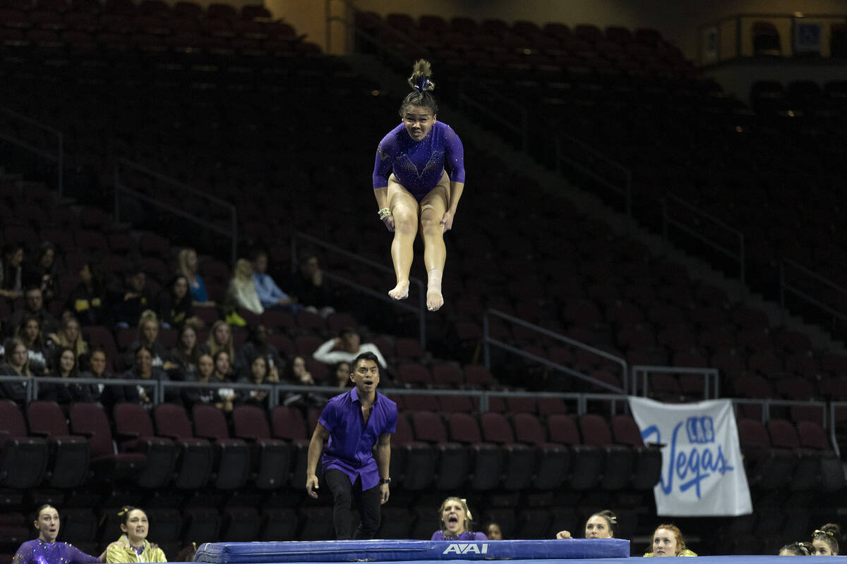 University of Washington’s Lana Navarro performs her floor routine during session one of ...