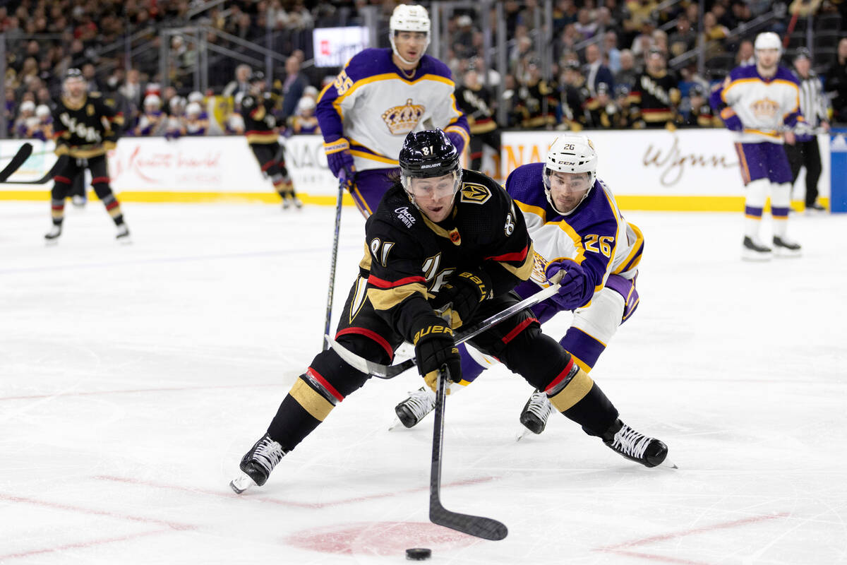Vegas Golden Knights center Jonathan Marchessault (81) reaches for the puck in front of Los Ang ...