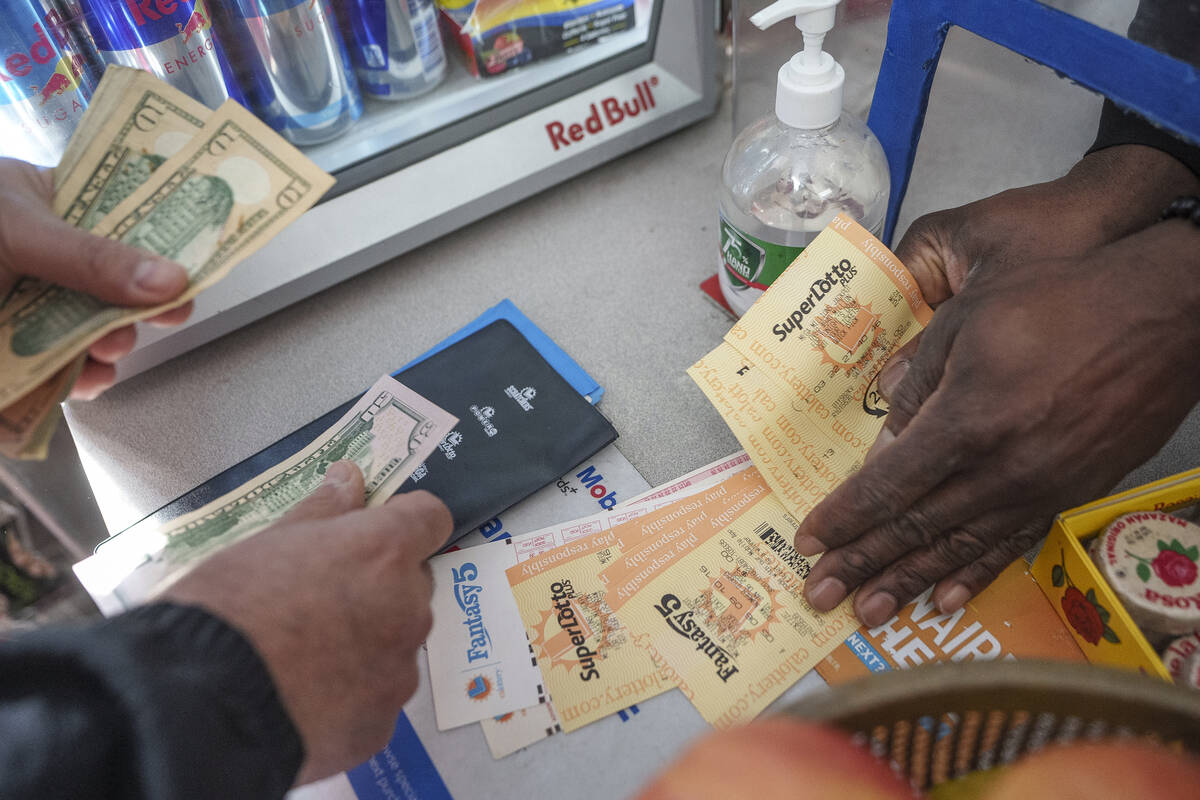 People buy SuperLotto tickets at the Mobil gas station that previously sold the $2.04 billion-w ...