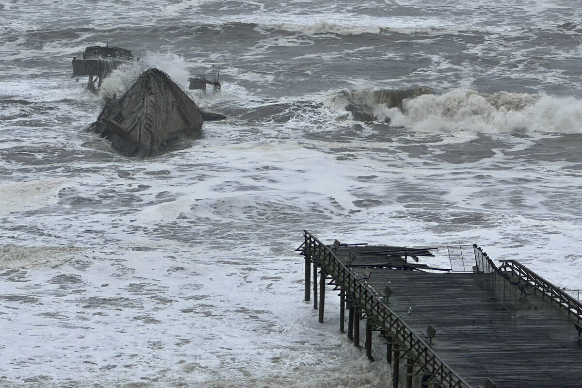 A section of the Seacliff State Beach Pier is decimated from heavy storm surf, Thursday, Jan. 5 ...