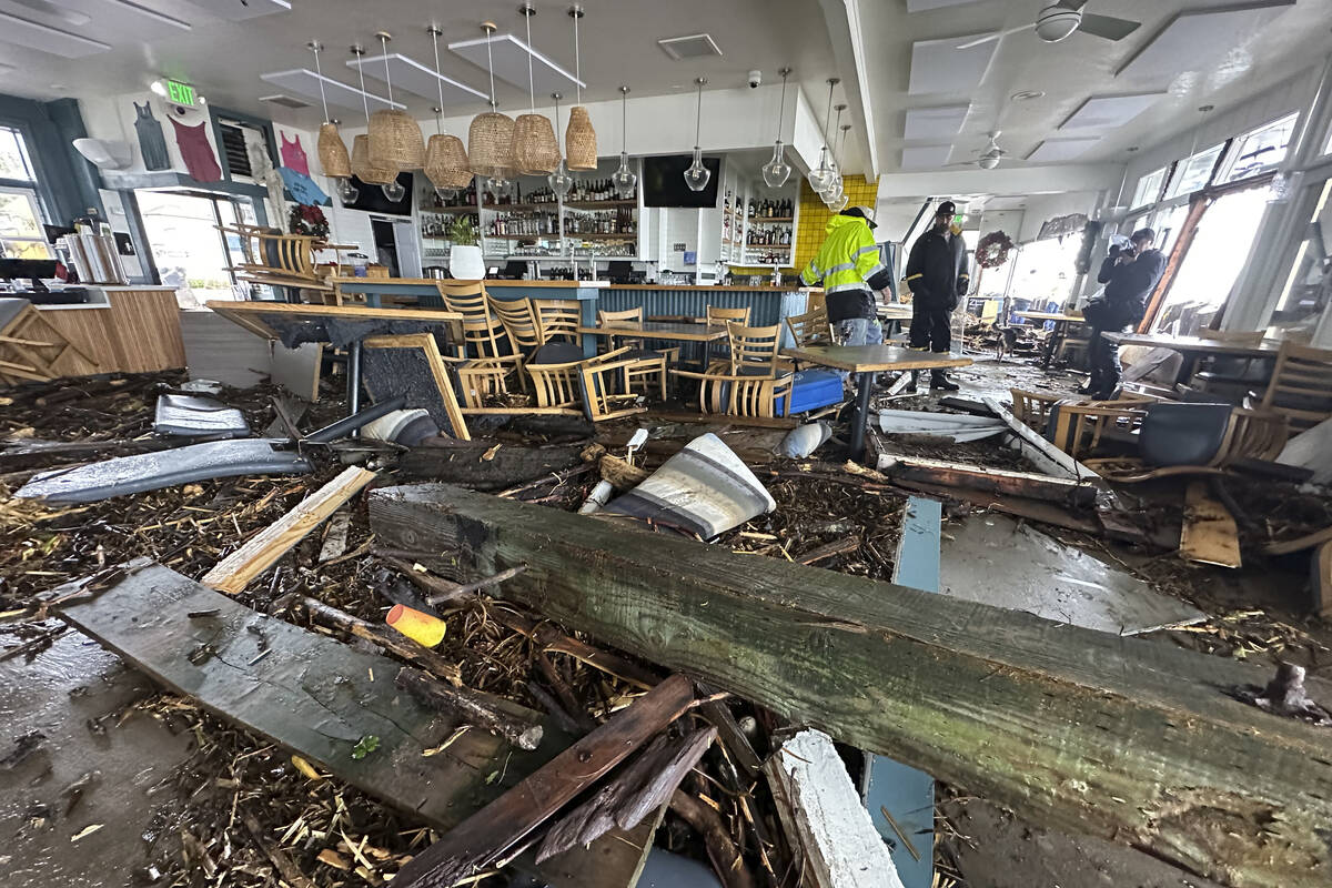 A support piece from the Capitola Wharf is seen inside the storm damaged Zelda's restaurant in ...