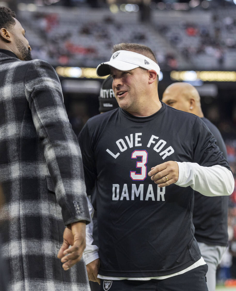 Raiders head coach Josh McDaniels wears a shirt for Buffalo Bills’ defensive back Damar ...