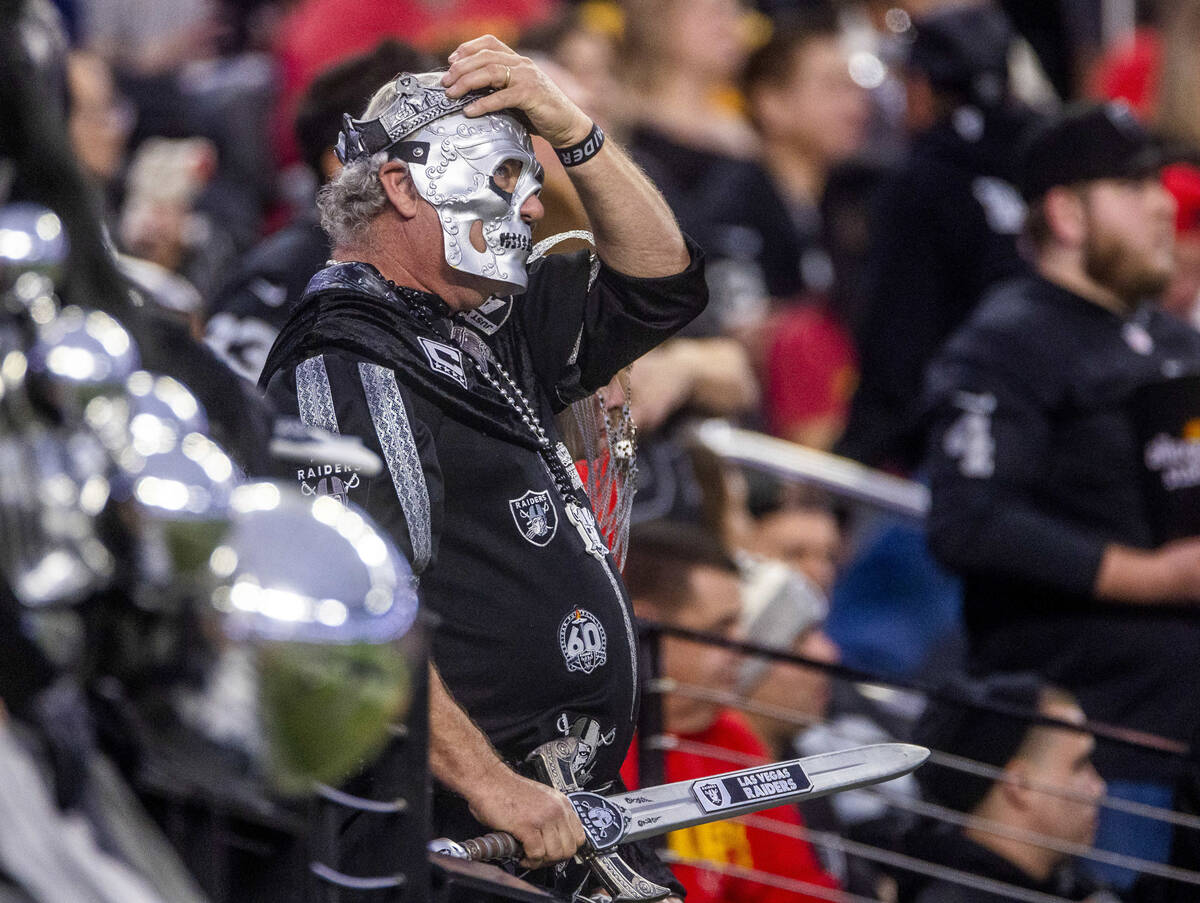 A raiders fan looks on in dismay as the Kansas City Chiefs dominate during the second half of t ...