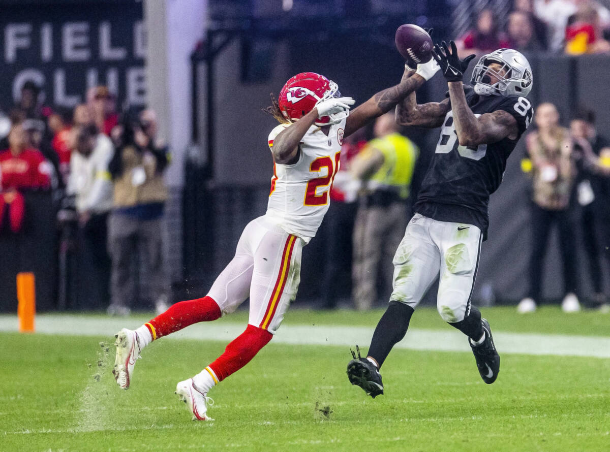 Kansas City Chiefs safety Justin Reid (20) breaks ups long pass to Raiders tight end Darren Wal ...