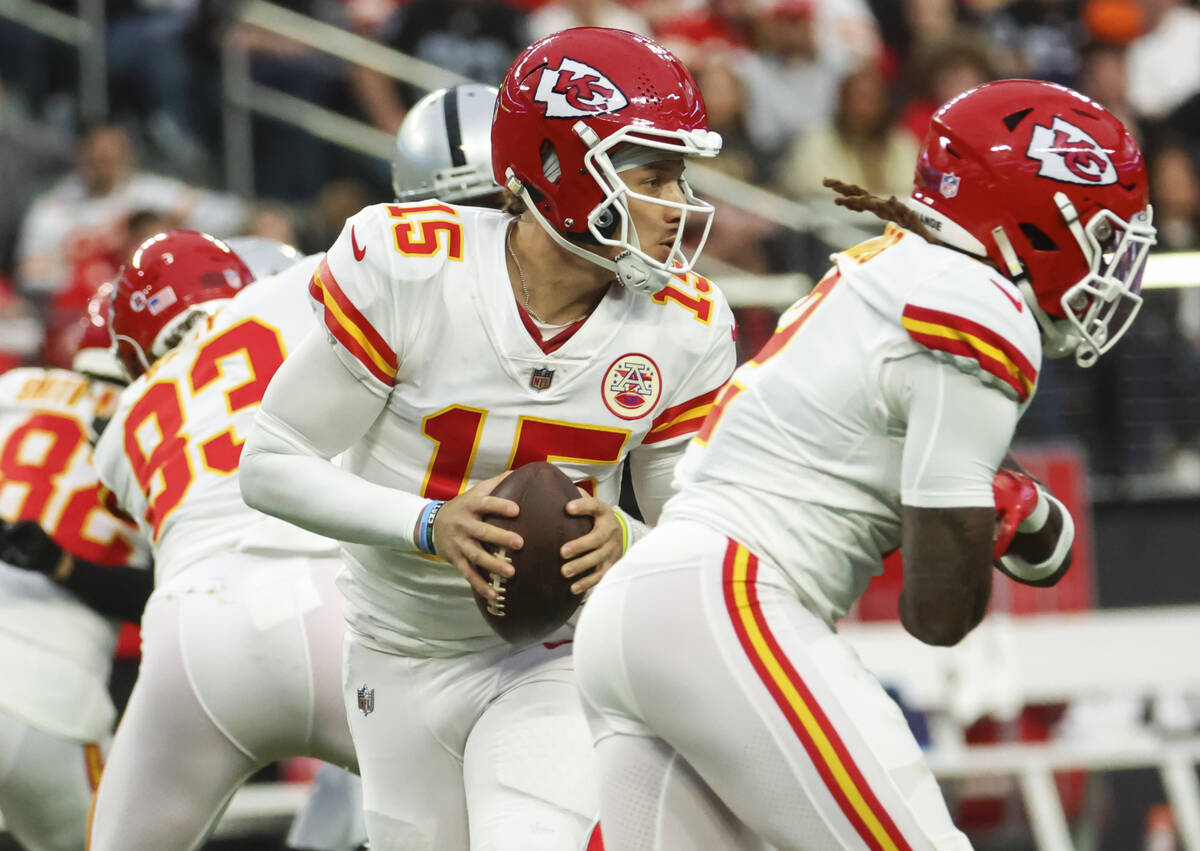 Kansas City Chiefs quarterback Patrick Mahomes (15) looks to pass the ball during the first hal ...