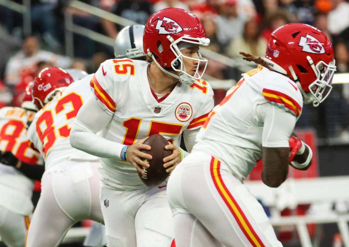 Kansas City Chiefs quarterback Patrick Mahomes (15) looks to pass the ball during the first hal ...