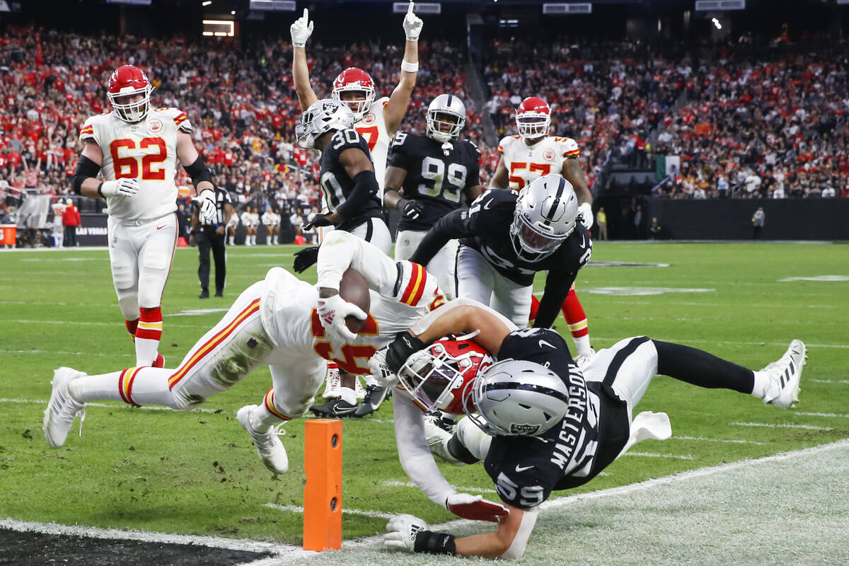 Kansas City Chiefs wide receiver Kadarius Toney (19) scores a touchdown while being tackled by ...