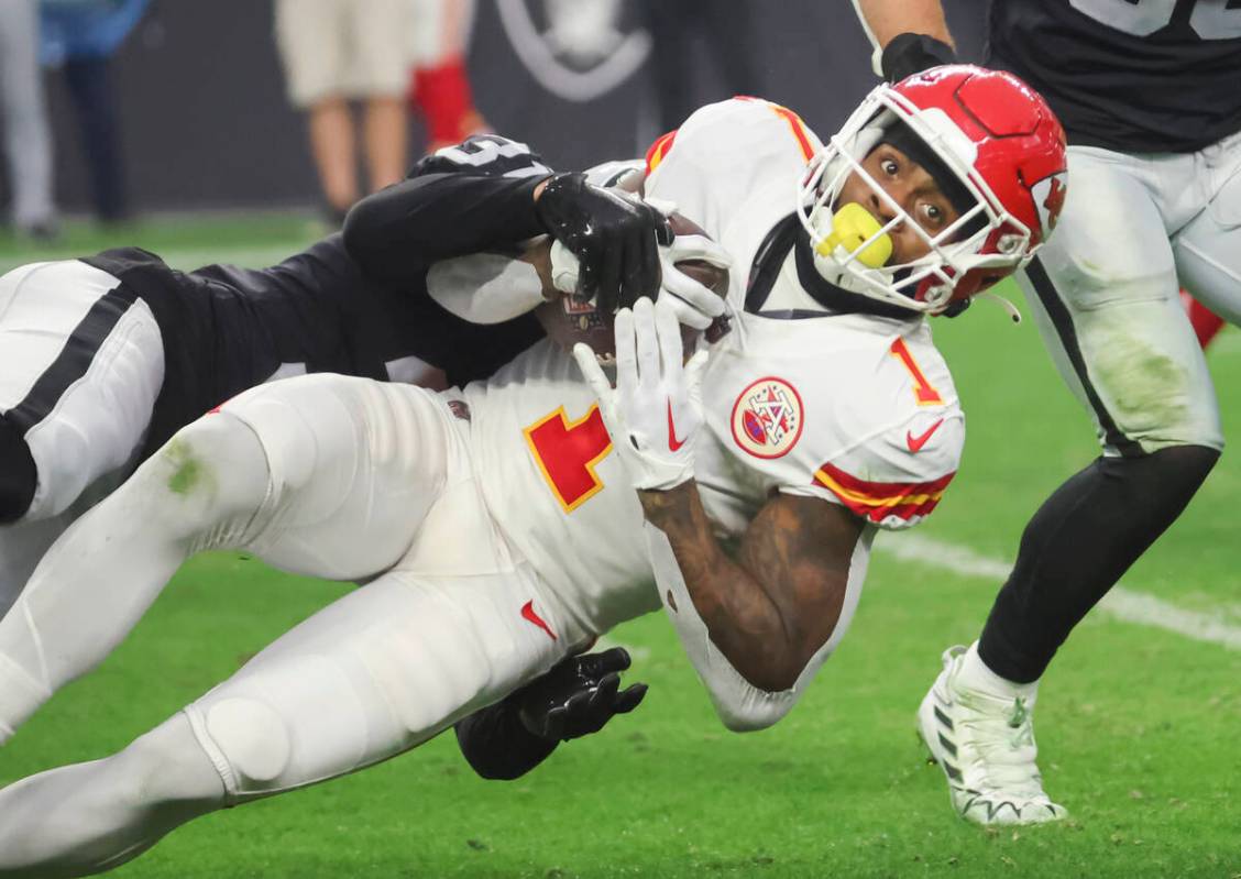 Raiders cornerback Sidney Jones IV (31) tackles Kansas City Chiefs running back Jerick McKinnon ...