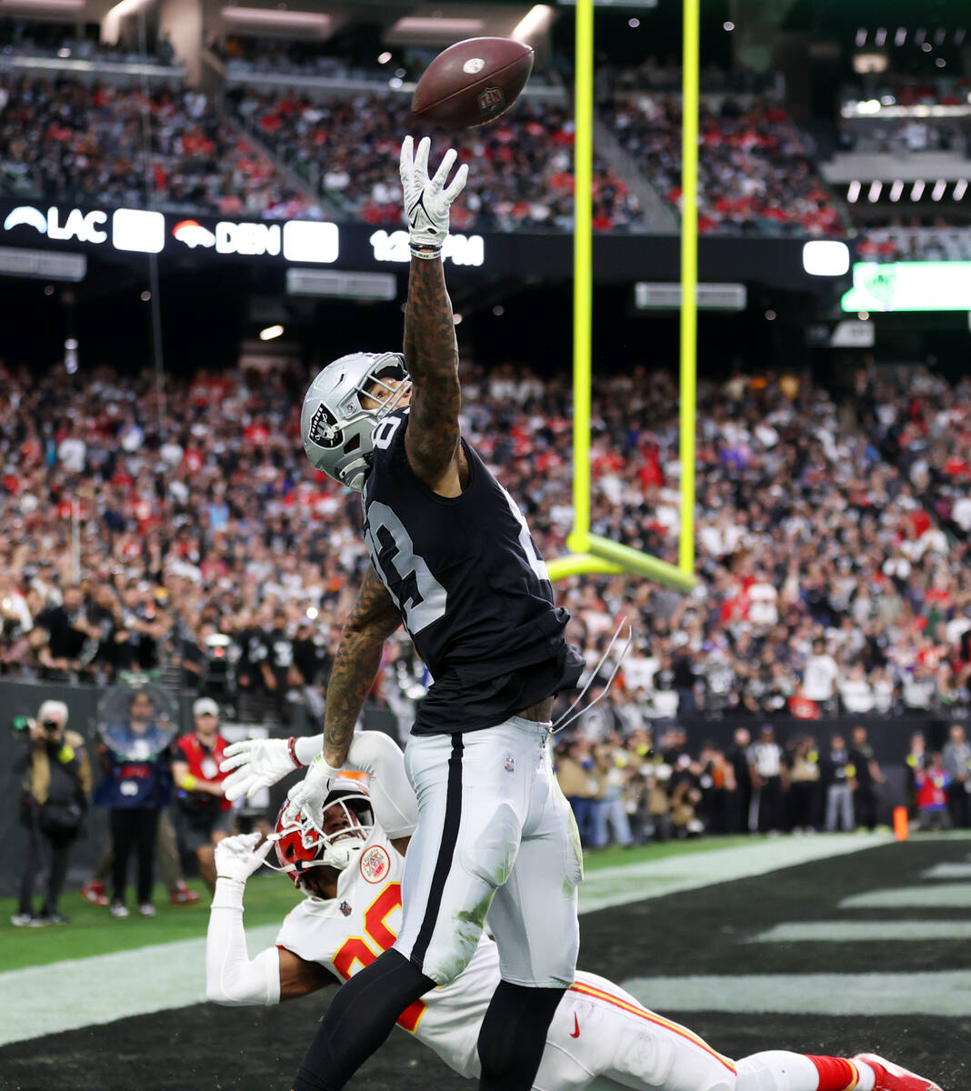 Las Vegas Raiders tight end Darren Waller (83) misses a pass in the end zone under pressure fro ...
