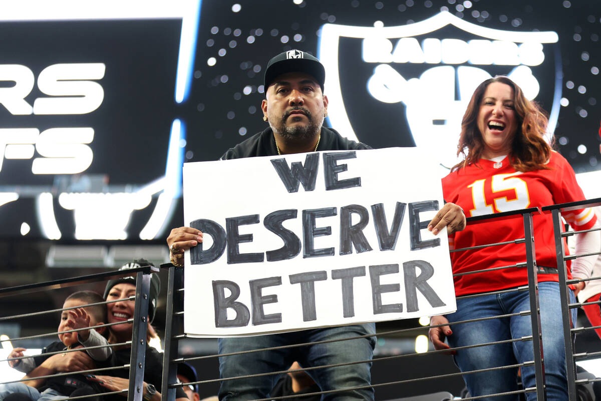 A fan displays a sign during the first half of a NFL football game between the Las Vegas Raider ...