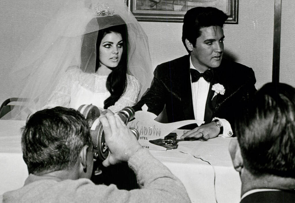 FILE - Elvis and Pricilla Presley on their wedding day at the Aladdin hotel and casino on the L ...