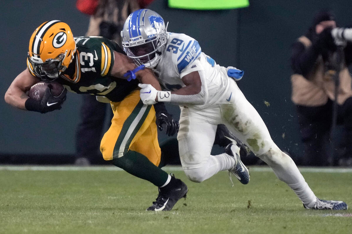 Green Bay Packers wide receiver Allen Lazard (13) is stopped by Detroit Lions cornerback Jerry ...