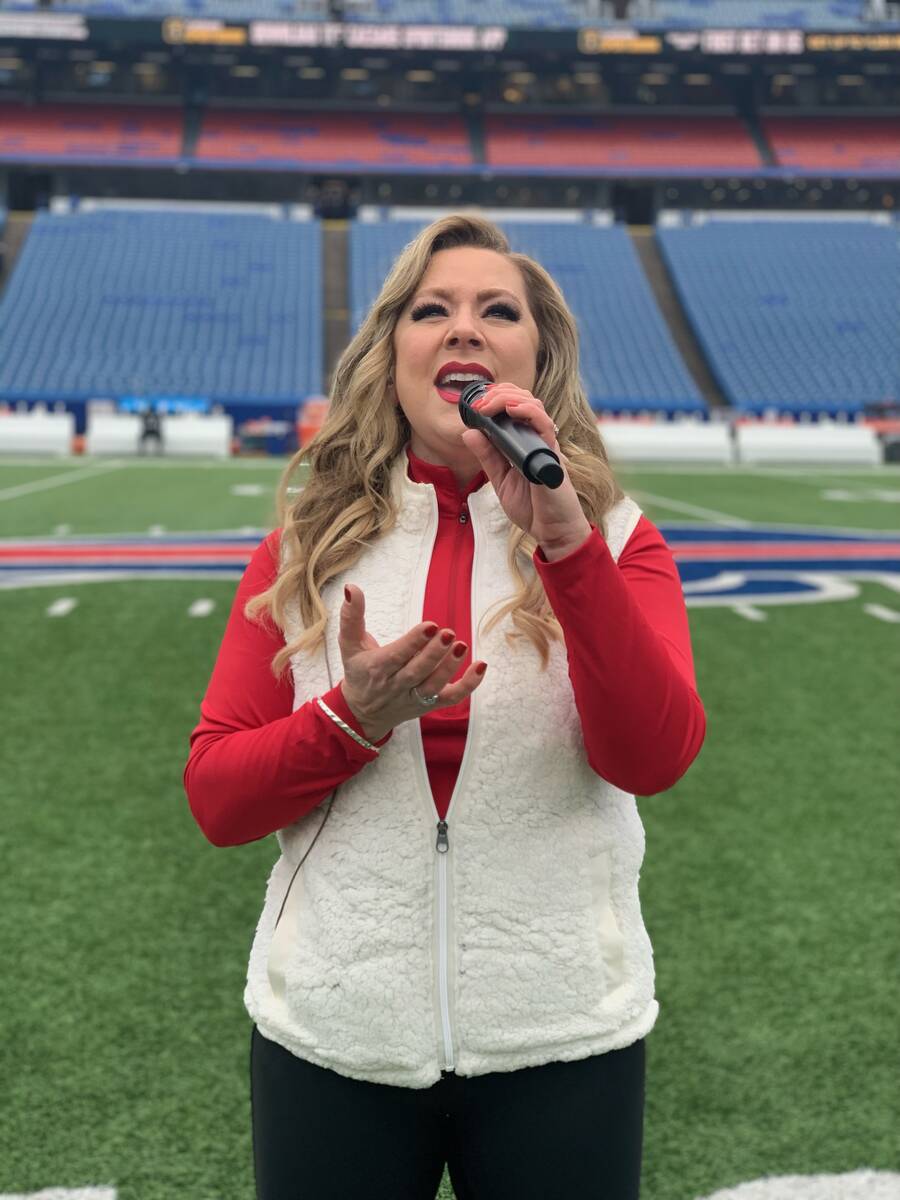 Las Vegas singer Janae Longo rehearses the national anthem at Highmark Stadium in Orchard Park, ...