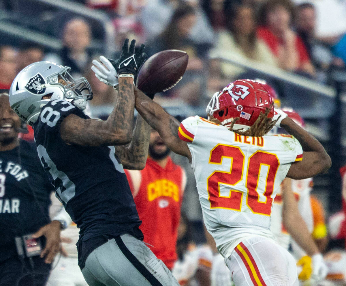 Kansas City Chiefs safety Justin Reid (20) defends a pass intended for Raiders tight end Darren ...
