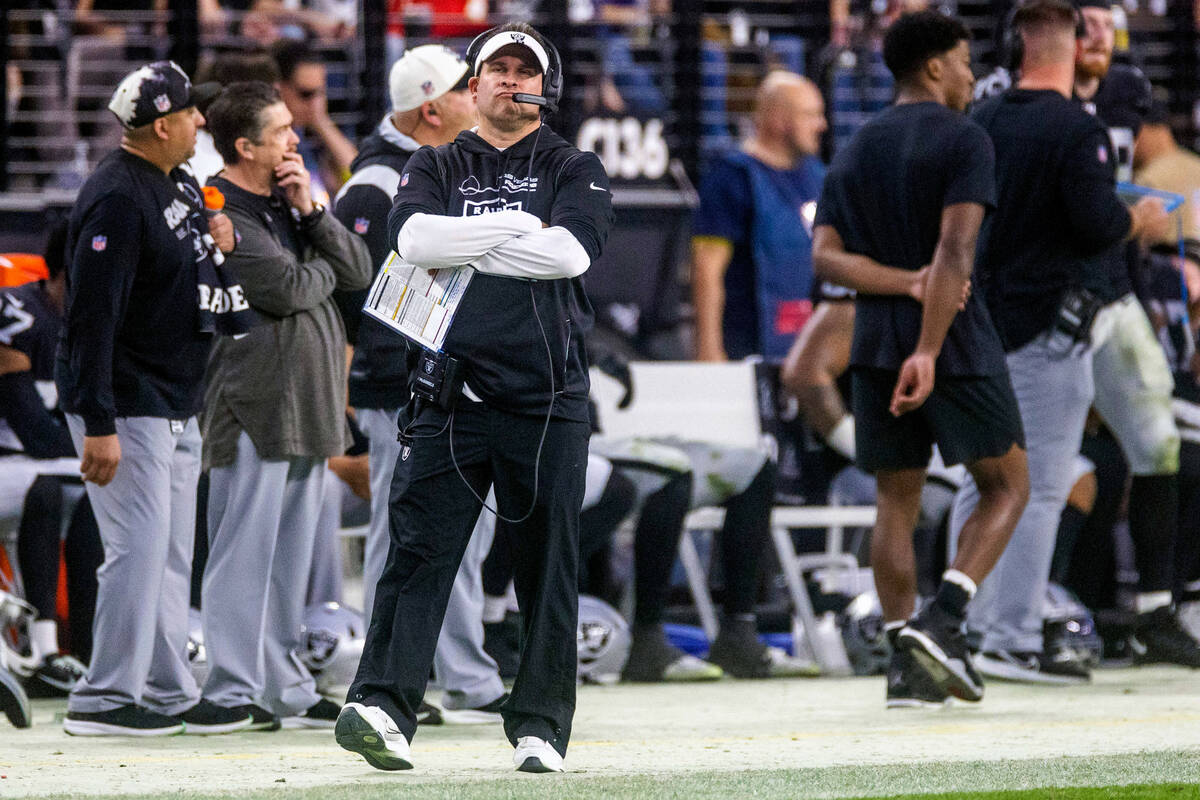 Raiders coach Josh McDaniels walks the sideline during the second half of their NFL game agains ...