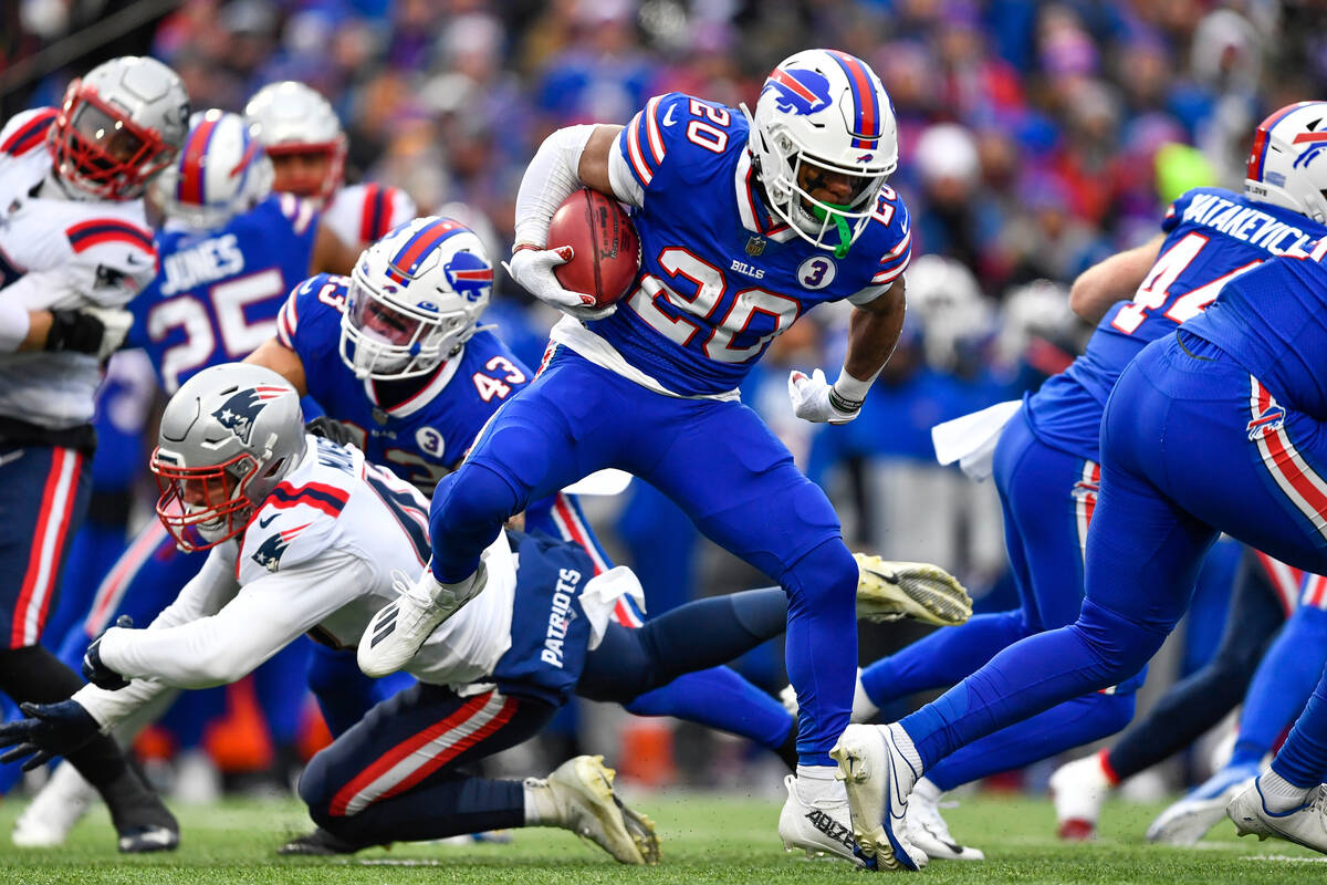 Buffalo Bills running back Nyheim Hines (20) runs in a touchdown on a kickoff return during the ...