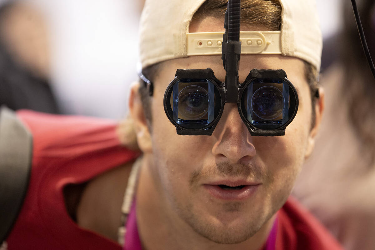 Daniel Escobar, of California, tests Ant Reality Optics’ augmented reality devices durin ...