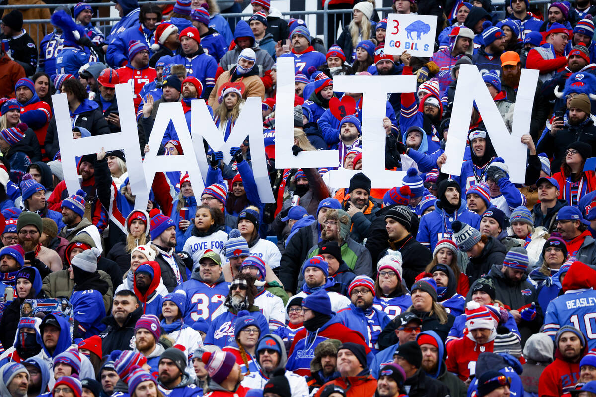 Fans hold a sign in support of Buffalo Bills safety Damar Hamlin during the second half of an N ...