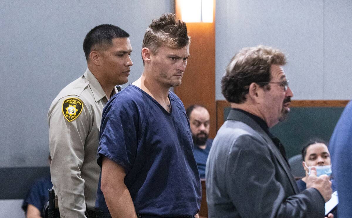 Christopher Martell, center, appears in court with his attorney, Mace Yampolsky, during a heari ...