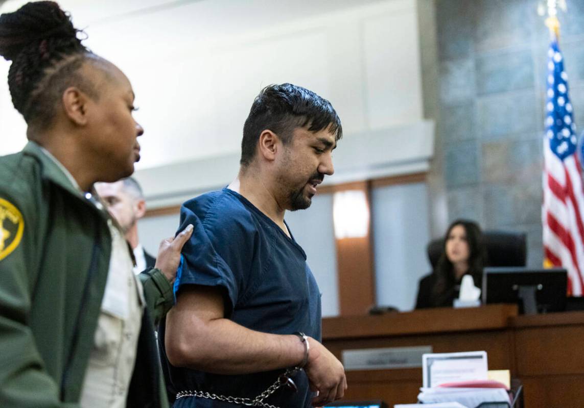 Mohammed Mesmarian, who is facing arson and terrorism charges, is led out of the courtroom afte ...