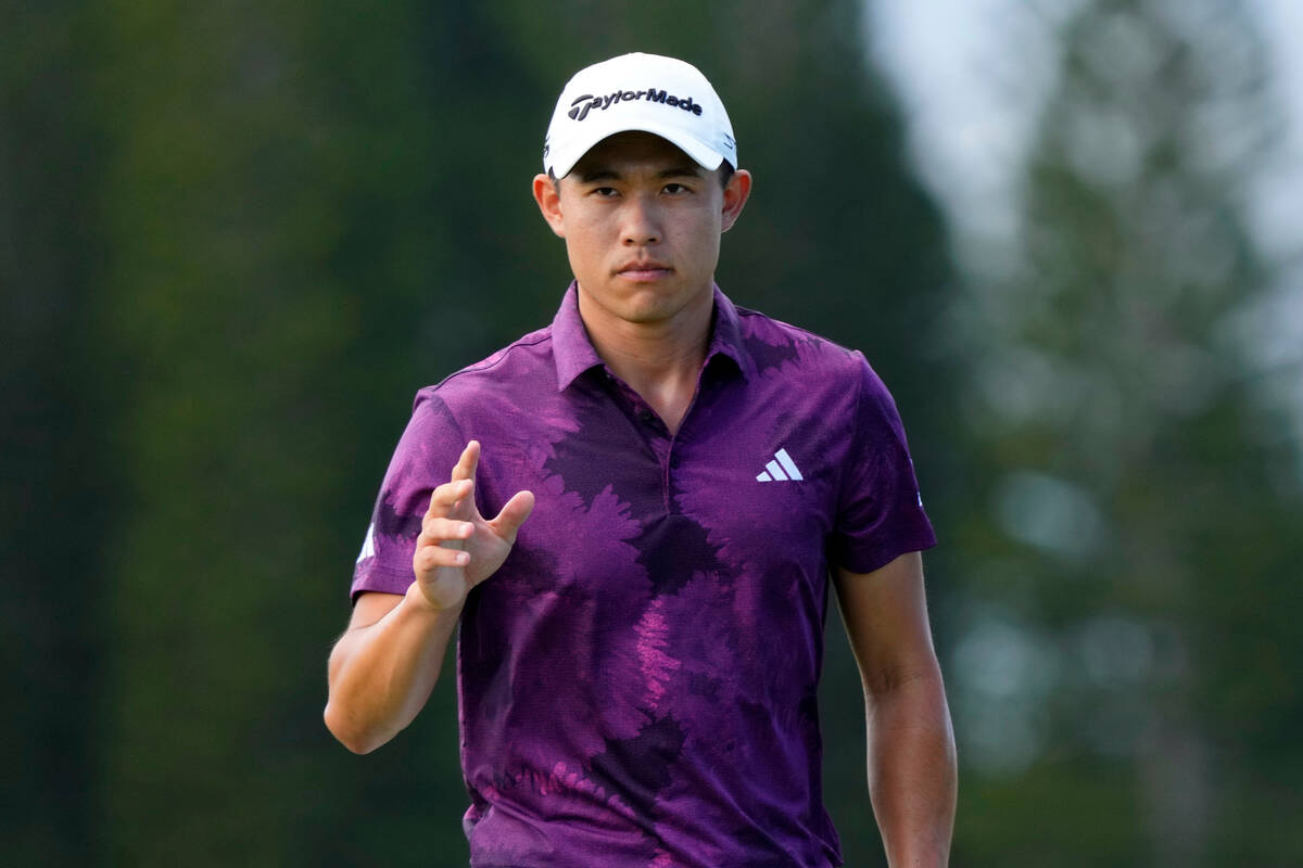 Collin Morikawa acknowledges the gallery after making his birdie putt on the ninth green during ...