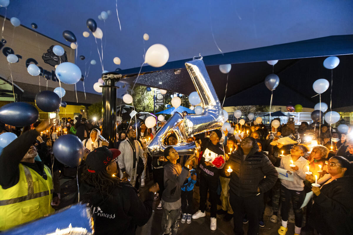 Balloons are released into the sky by family and friends during a celebration of life in memory ...