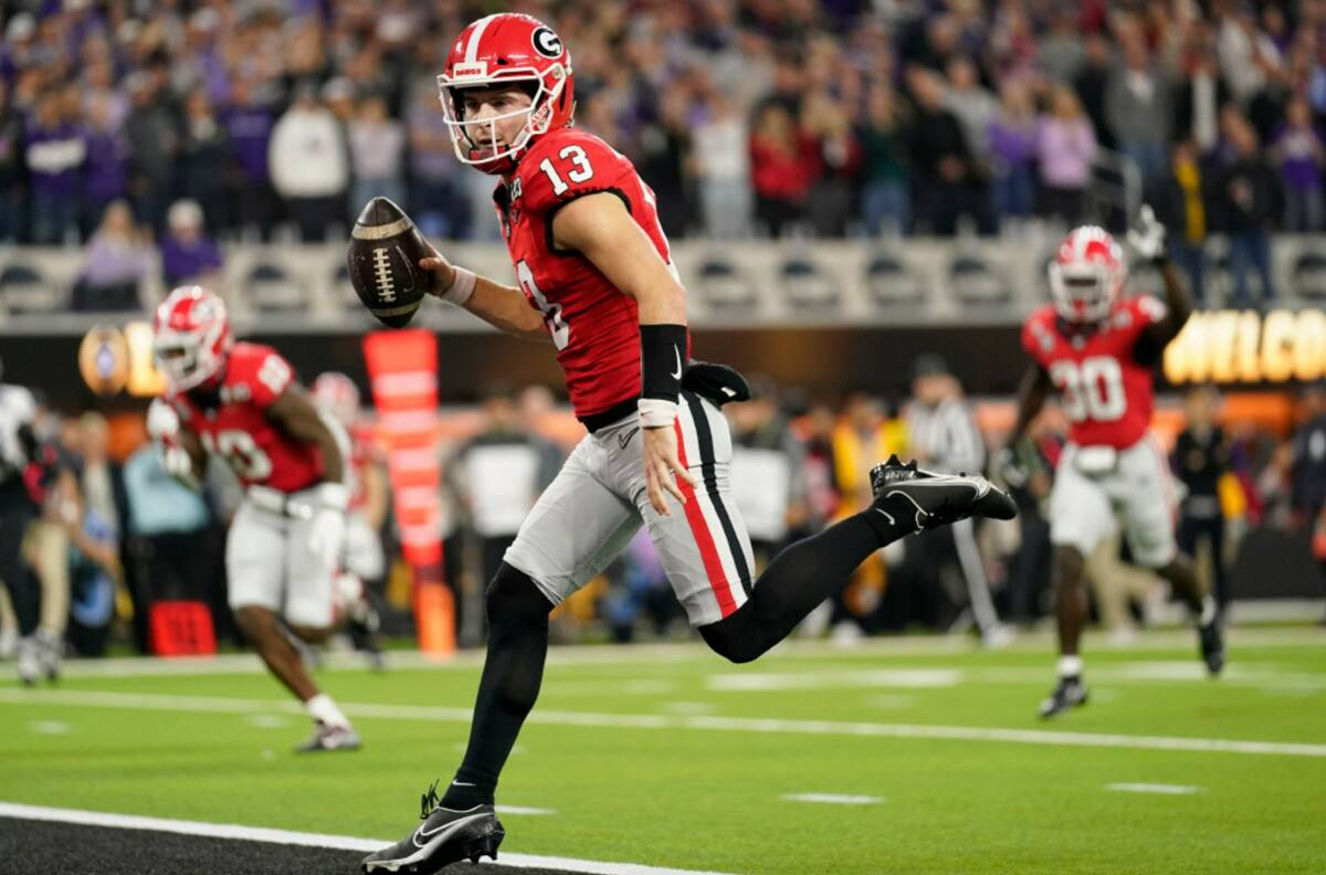 Georgia quarterback Stetson Bennett (13) runs into the end zone for a touchdown against TCU dur ...