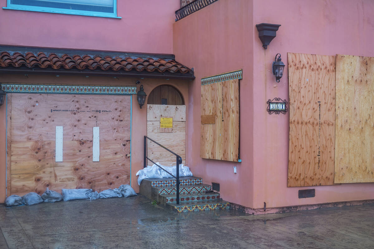 A boarded up house on Beach Drive in Aptos, Calif., Monday, Jan. 9, 2023. (AP Photo/Nic Coury)