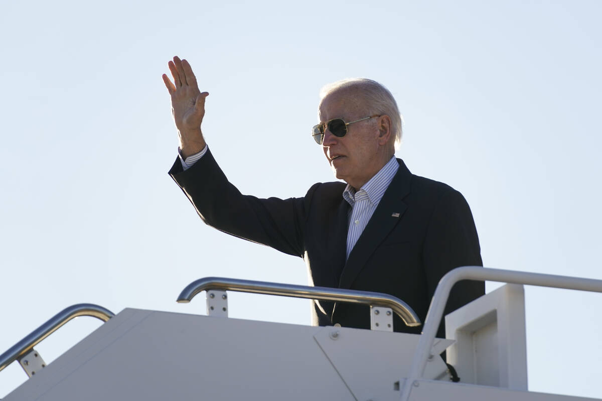 FILE - President Joe Biden waves before boarding Air Force One at El Paso International Airport ...