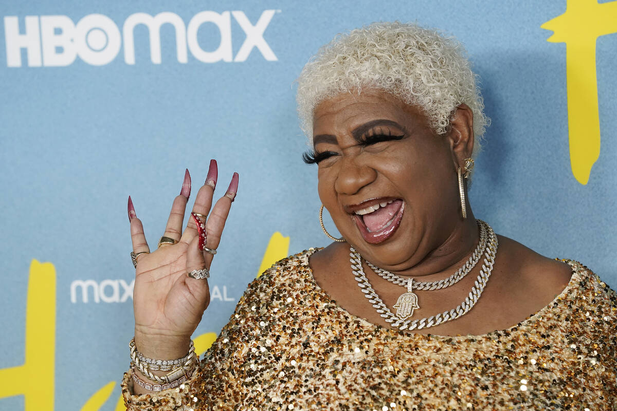 Luenell, a cast member in "Hacks," waves to photographers at the Season 2 premiere of ...