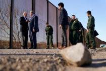 President Joe Biden talks with Oscar Leeser, Mayor of the City of El Paso, Texas, as they stand ...