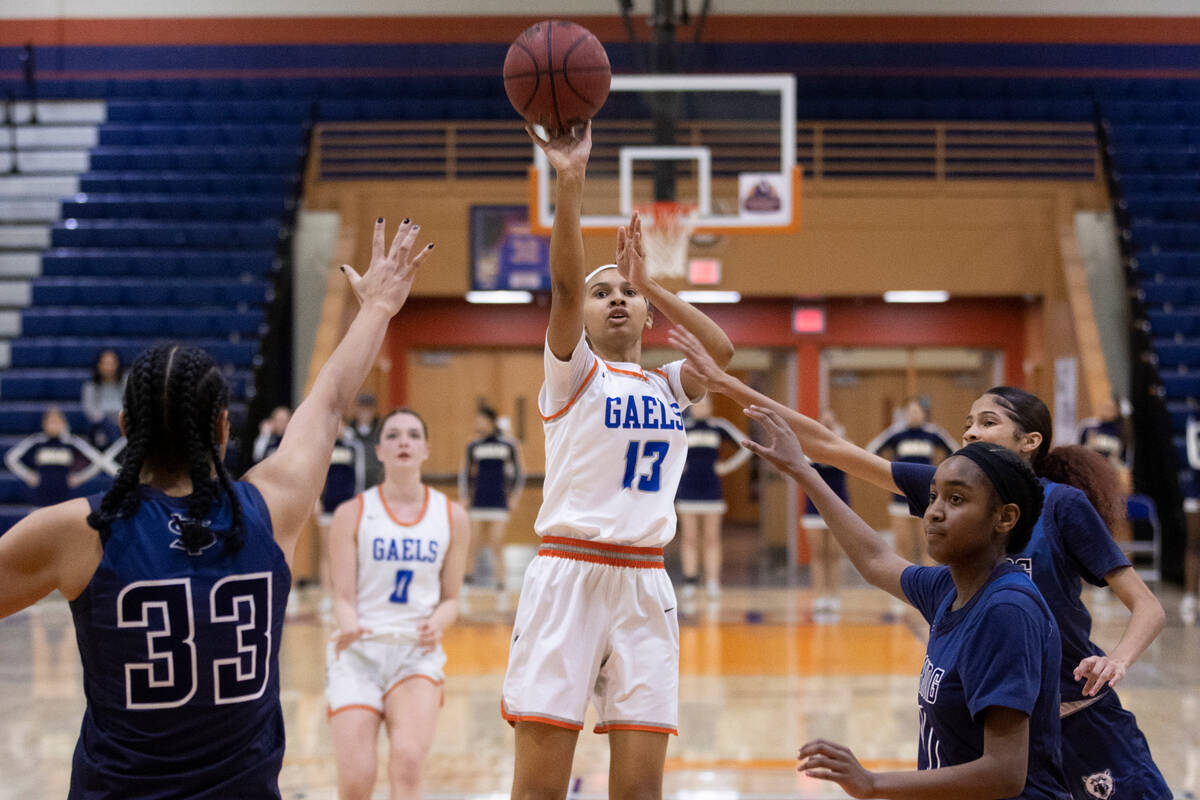 Bishop Gorman guard Reina Bell (13) shoots over Spring Valley forward Briana Green (33) in the ...