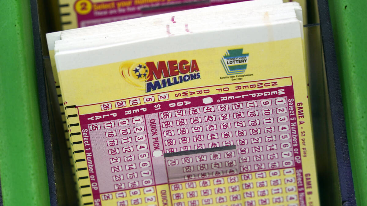 Mega Million cards are displayed at the Fuel On Convenience store in Pittsburgh, Monday, Jan. 9 ...