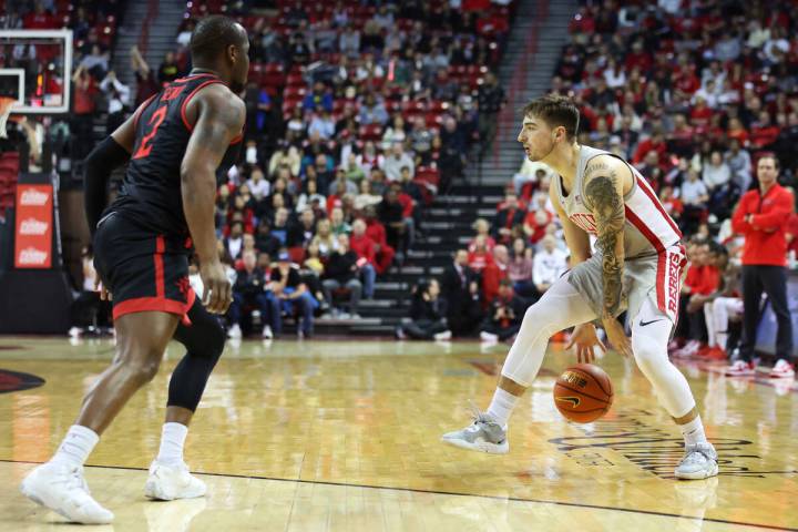 UNLV Rebels guard Jordan McCabe (5) dribbles the ball as San Diego State Aztecs guard Adam Seik ...