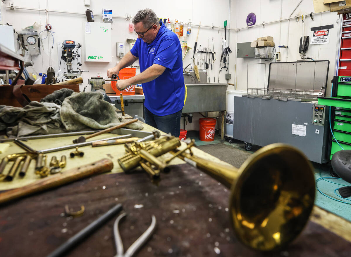 Cameron Gates, a musical instrument repair technician for the Clark County School District, rep ...