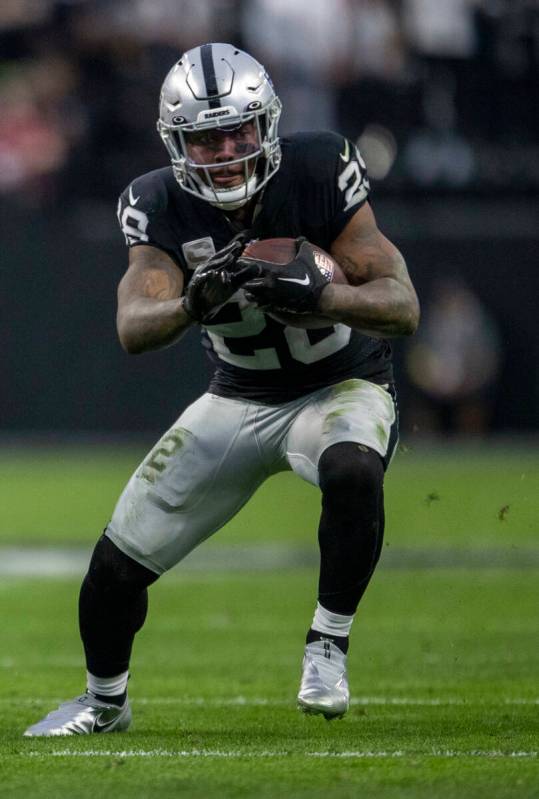 Raiders running back Josh Jacobs (28) runs against the San Francisco 49ers during the first hal ...