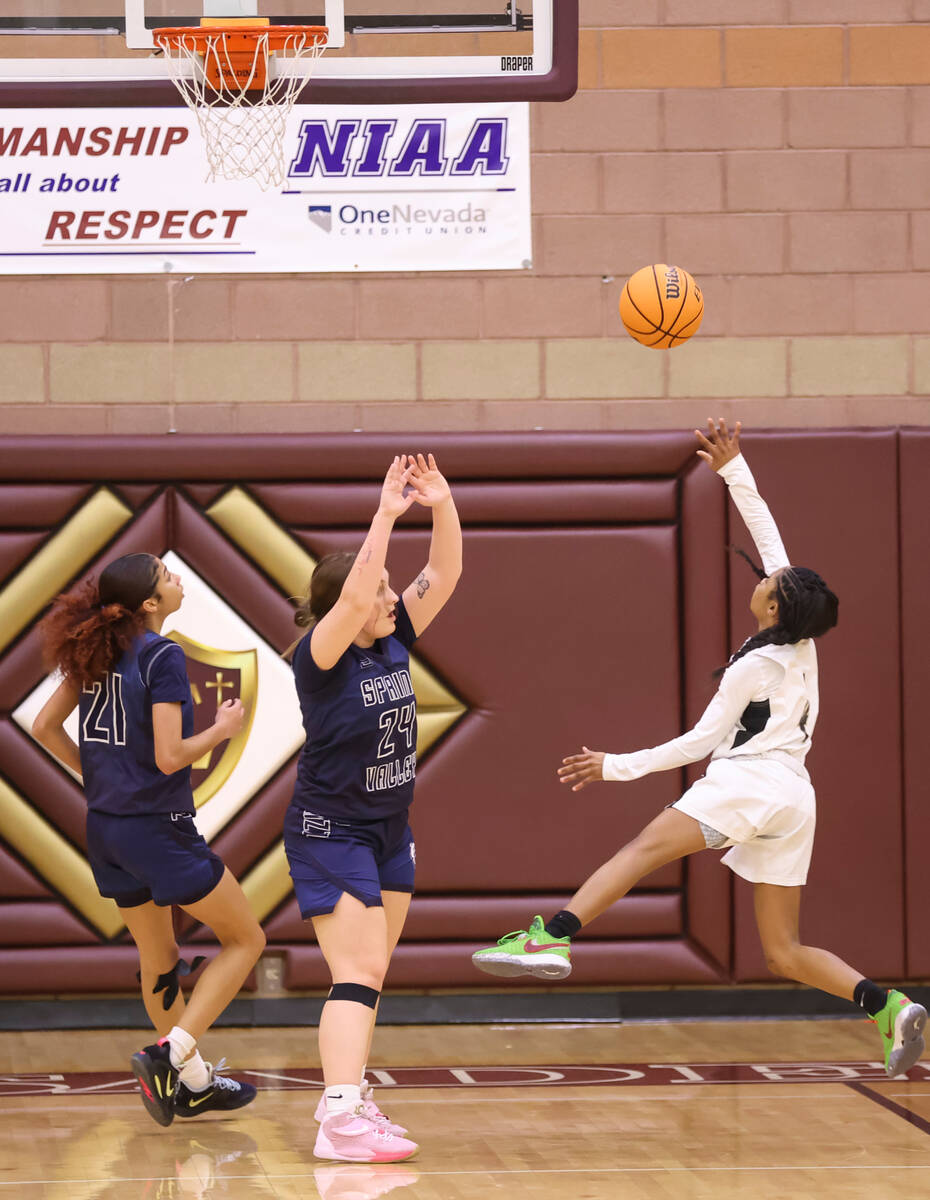 Faith Lutheran's Tamiah Harrison (4) shoots against Spring Valley during the first half of a ba ...