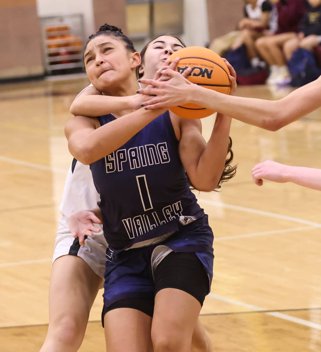 Spring Valley's Mia Ervin (1) gets fouled by Faith Lutheran's Emma Herpin on the drive during t ...