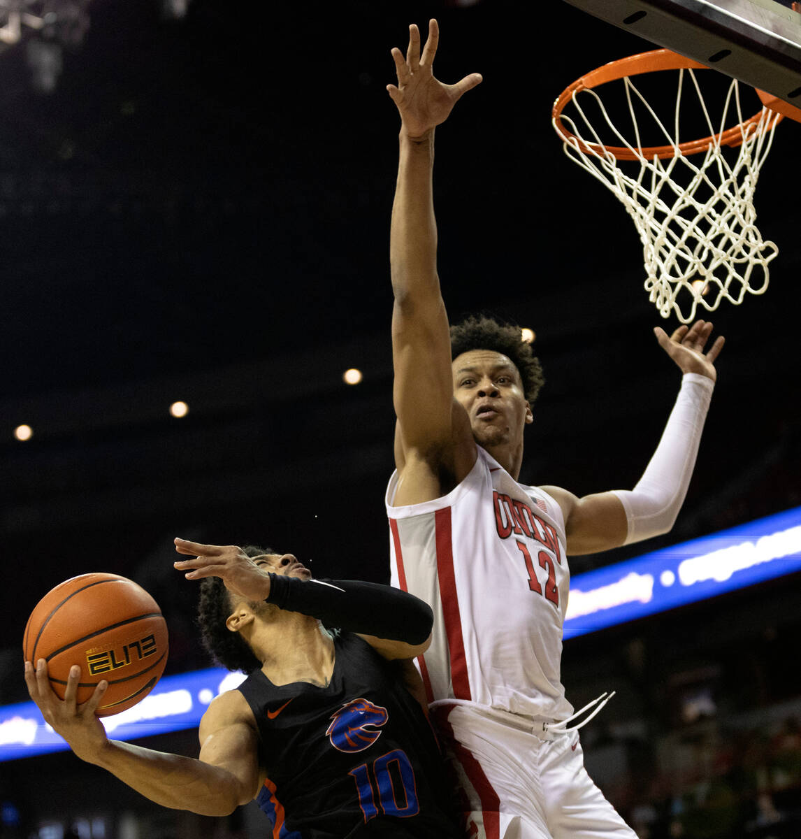 Boise State Broncos guard Marcus Shaver Jr. (10) shoots against UNLV Rebels center David Muoka ...