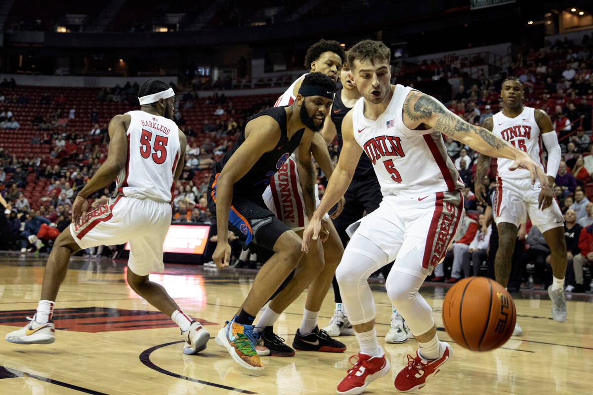 UNLV Rebels guard Jordan McCabe (5) pivots to keep the ball inbounds during the first half of a ...