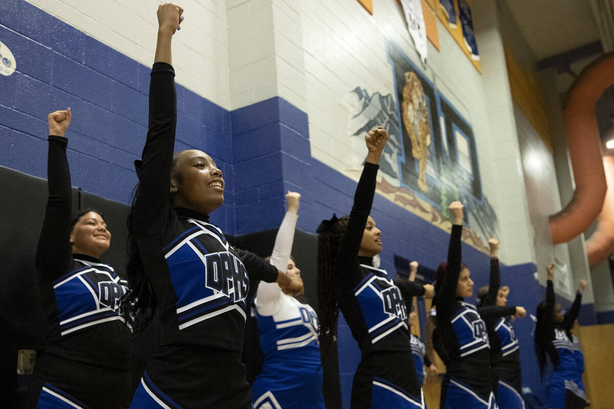 Desert Pines’ cheerleaders encourage their team during a boys high school basketball gam ...