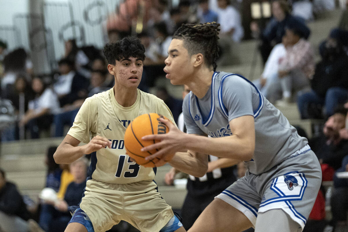 Desert Pines’ Curtis Coleman, right, looks to pass while Foothill’s Branden Castr ...