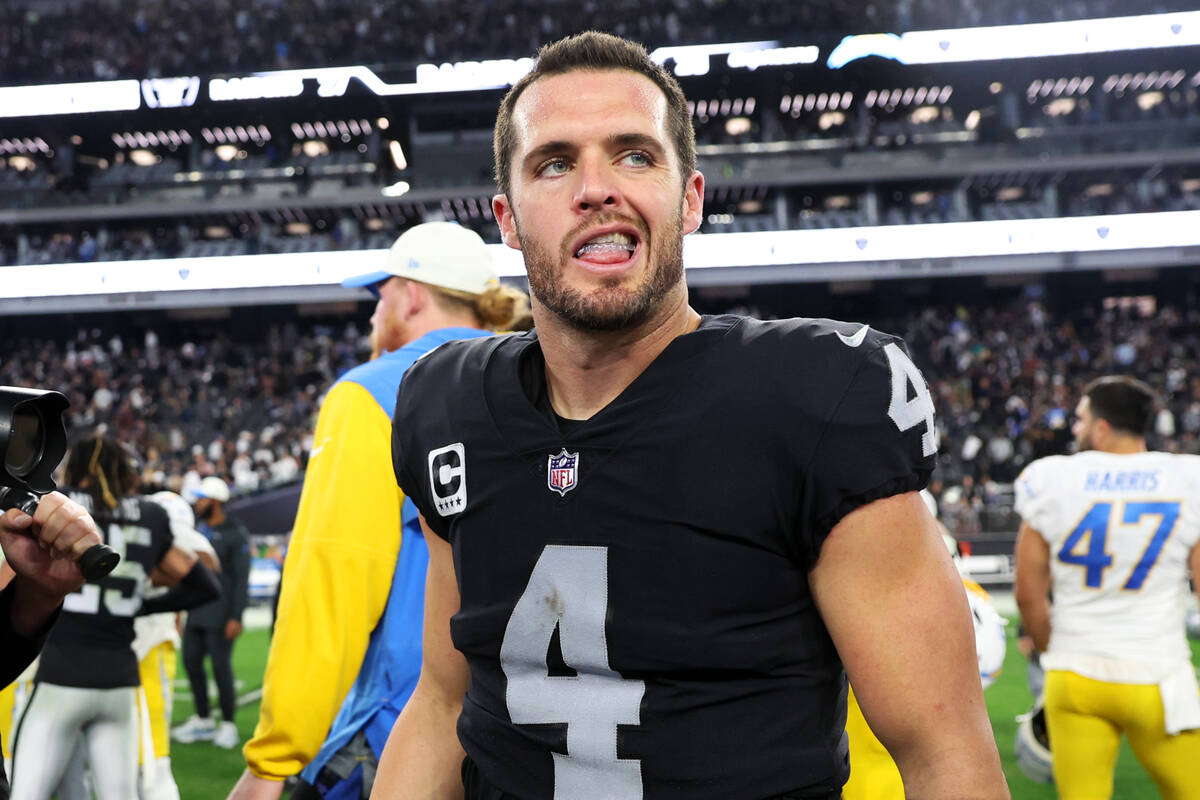 Raiders quarterback Derek Carr (4) walks on the field following a 27-20 win against the Los Ang ...