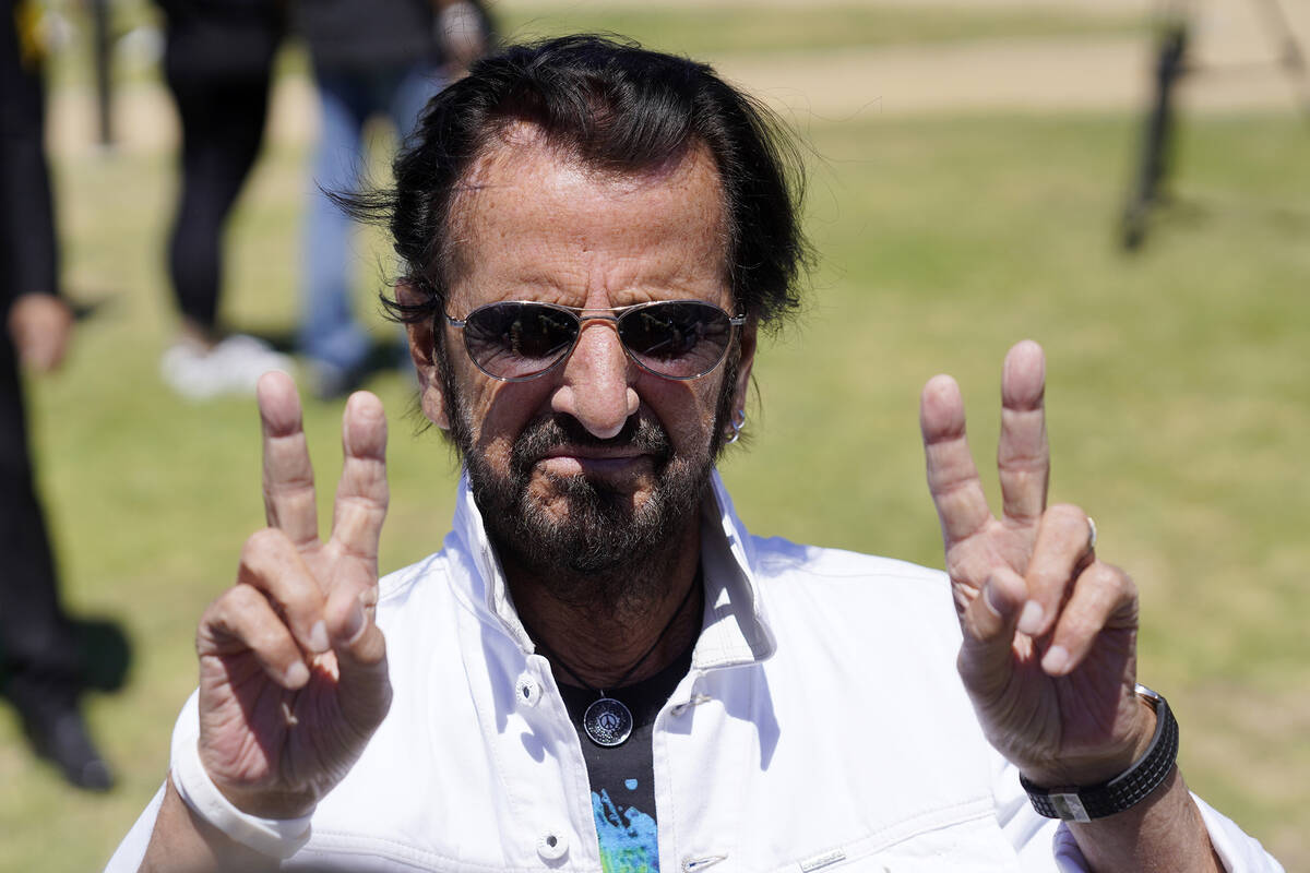 Ringo Starr flashes the peace sign during his annual Peace & Love Birthday Celebration, Thu ...