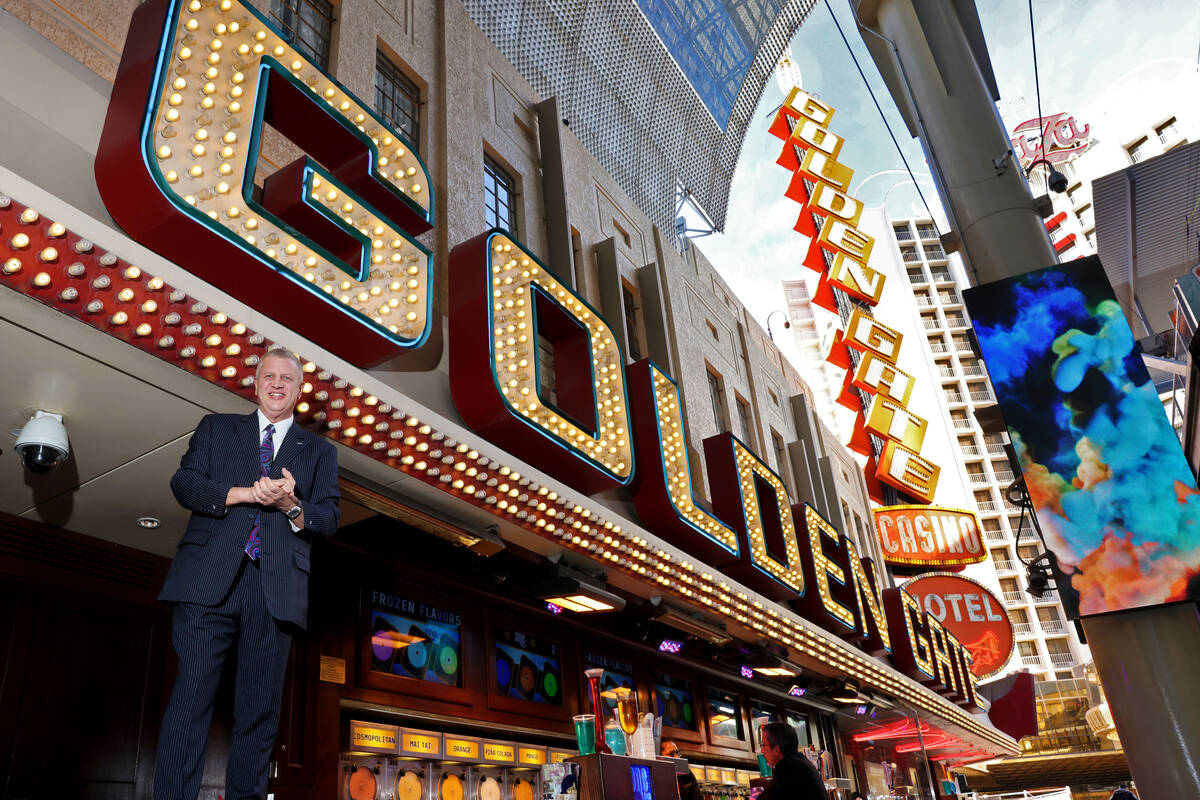 Co-owner Derek Stevens stand atop the outdoor bar at the Golden Gate in downtown Las Vegas Thur ...