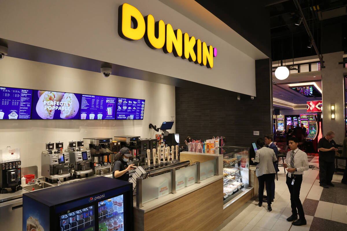 Guests get samples at Dunkin' during the grand opening of Fremont Hotel Casino’s new Foo ...